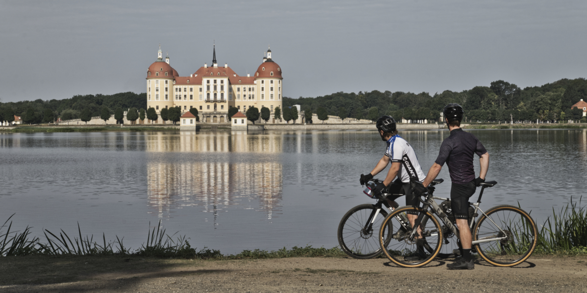Gravel biker with view to Moritzburg Castle in Germany