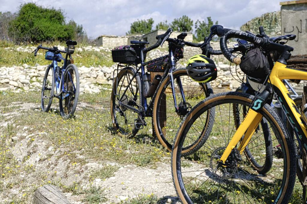 Gravel bikes in front of stone ruins on Cyprus