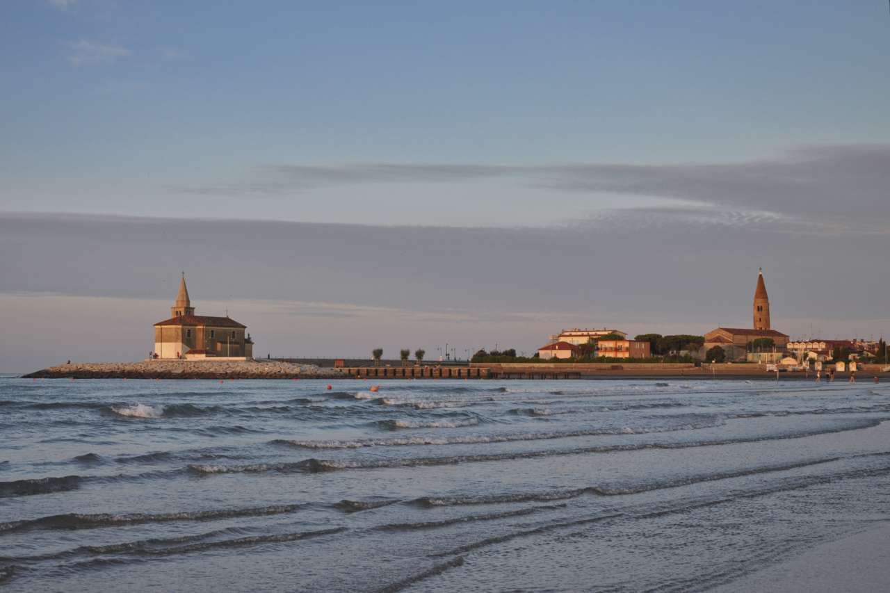 Church on a breakwater in Caorle at the golden hour
