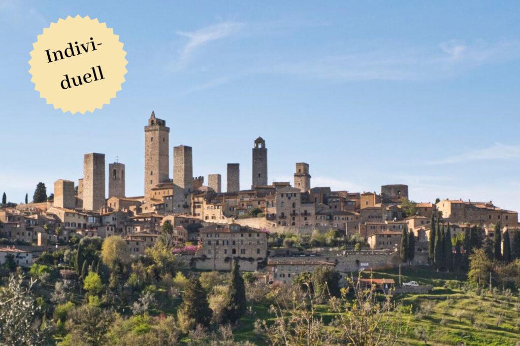 Vorschaubild für eine Gravelbike-Reise durch die Toskana. Zu sehen ist San Gimignano mit seinen mittelalterlichen Türmen.